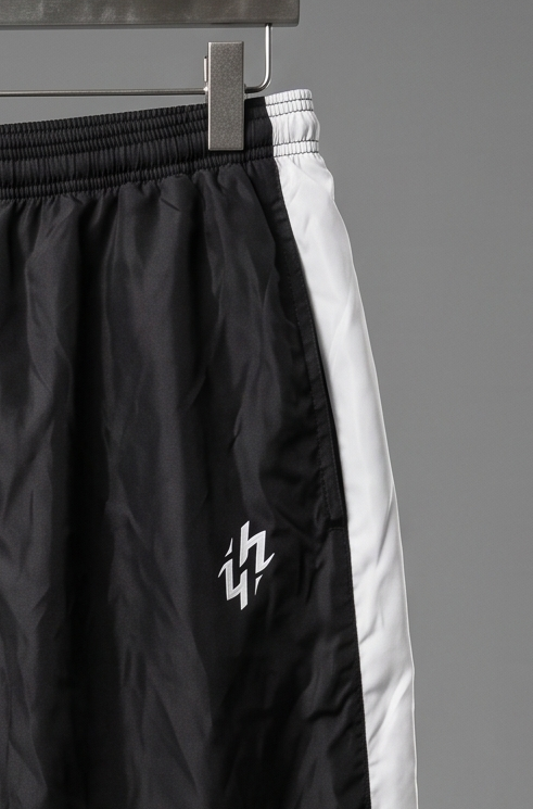 Track Pants Picos Hoppers - detalle del logo Hoppers
